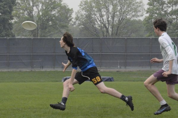 CATCH. Senior McKinley Garner lunges to catch the frisbee. The game was one from the 2023 spring season.