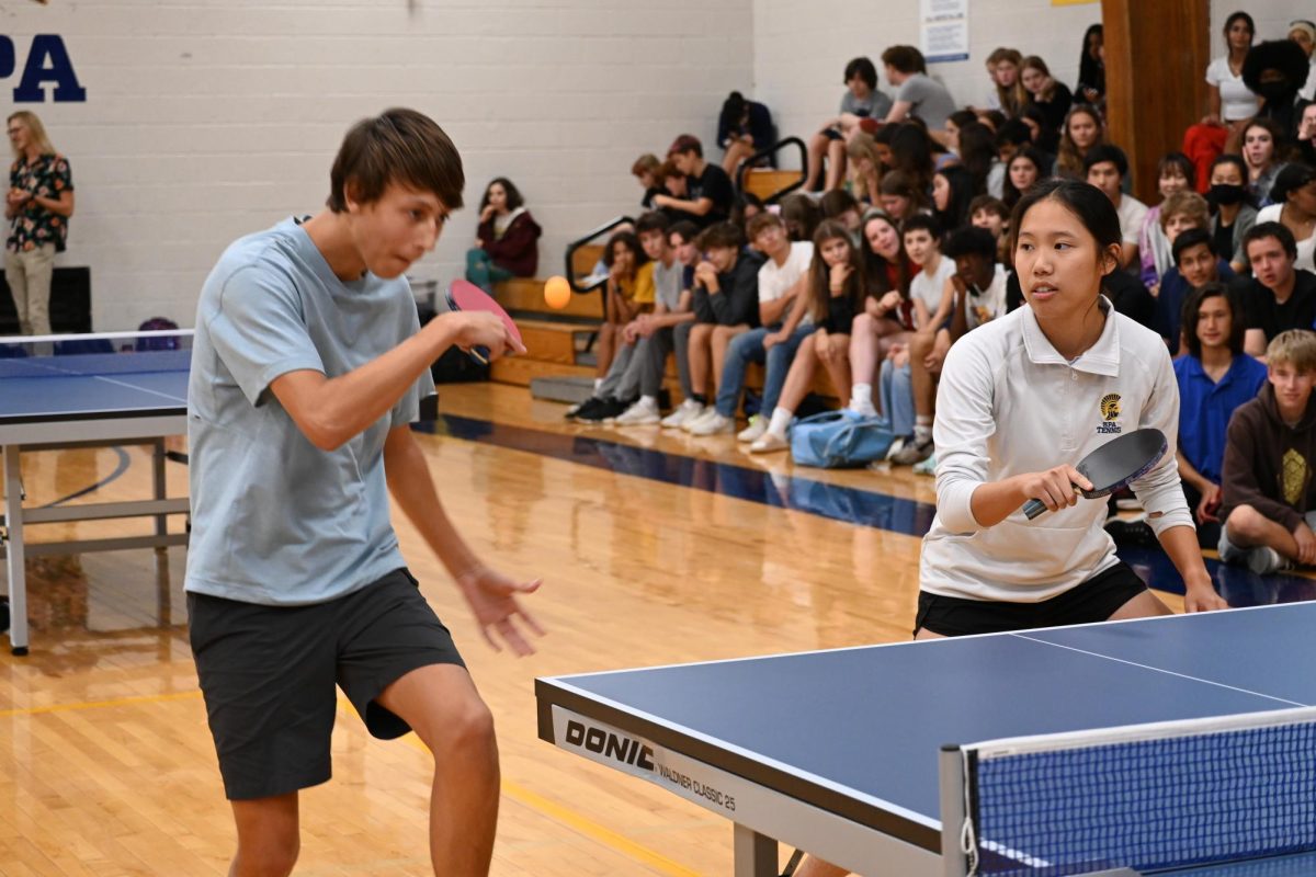 HERE I COME. Junior Aidan Willams strikes the incoming ball to his opponents.