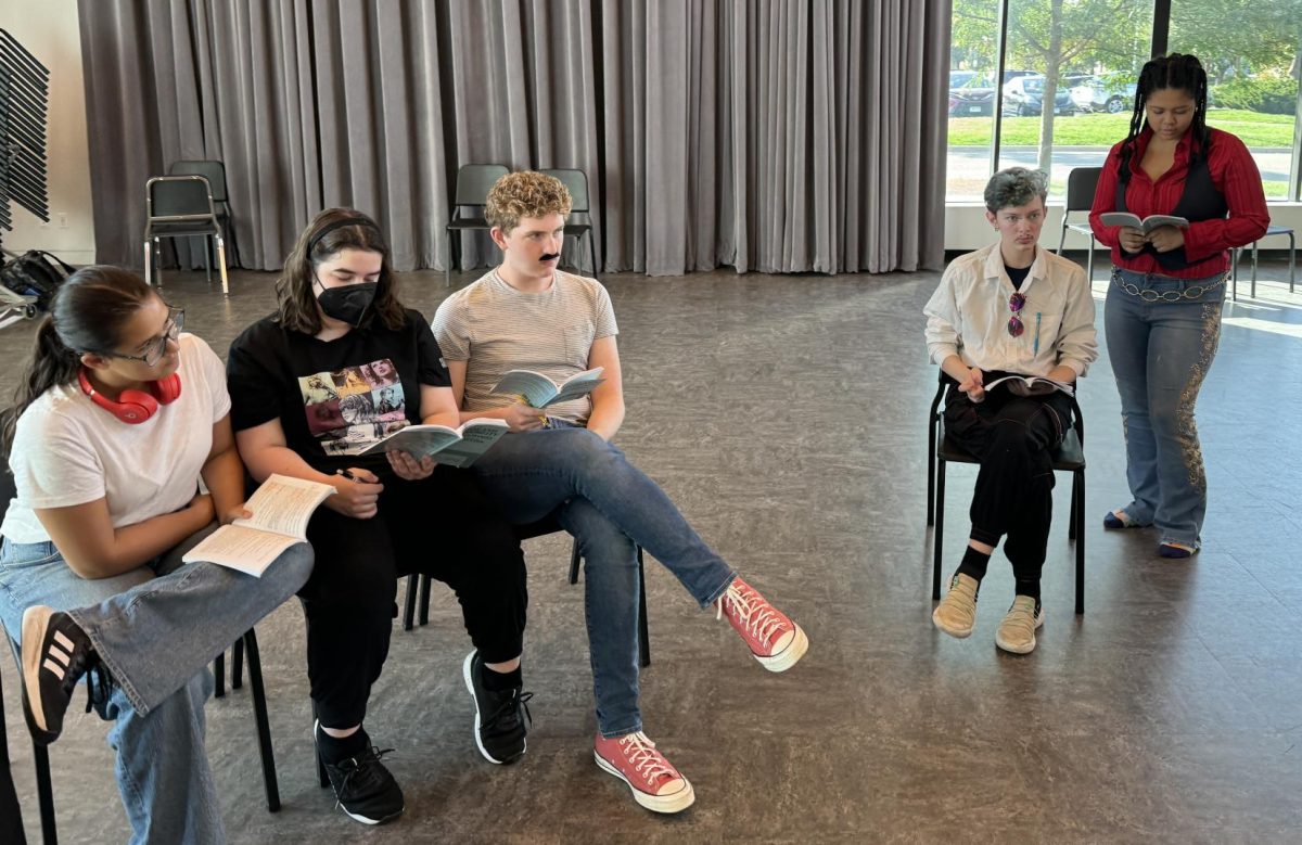 PRACTICE MAKES PERFECT. William Hanna and Grace Medrano listen as Director Eric Severson gives instructions.