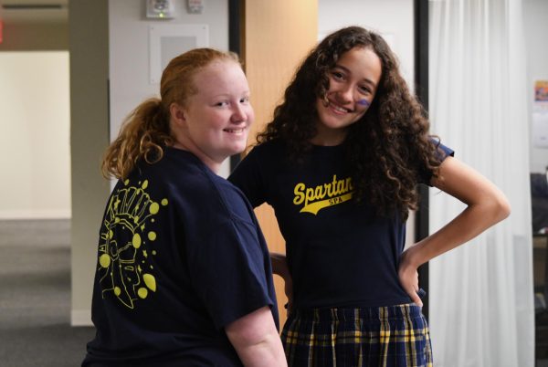 THE BOKEH DESIGNS. Freshmen Eva Johnson and Sofia Rivera featured from left to right. One day biology teacher Rachel Yost-Dubrow approached River and freshman Margaret Bonin to come up with a homecoming t-shirt design. We knew that the shirt was glow-in-the-dark, but we didnt know how else to interpret it. Some teachers gave us ideas like inserting glow-in-the-dark animals like jellyfish, but we wanted it to be more cohesive. So we came up with the idea of embedding bokeh, Rivera said. 