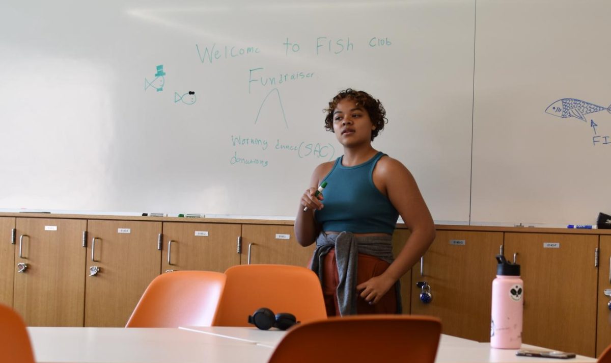 WELCOME TO FISH CLUB. Freshman January Cook leads a meeting of the Marine Biology Conservation Club, a club dedicated to fundraising and education the community about marine life. Cook kicked off the first meeting of the year by discussing the club’s future plans. “We are preparing the conduct a letter-writing campaign targeting prominent for-profit aquariams in Minnesota,” Cook said. 