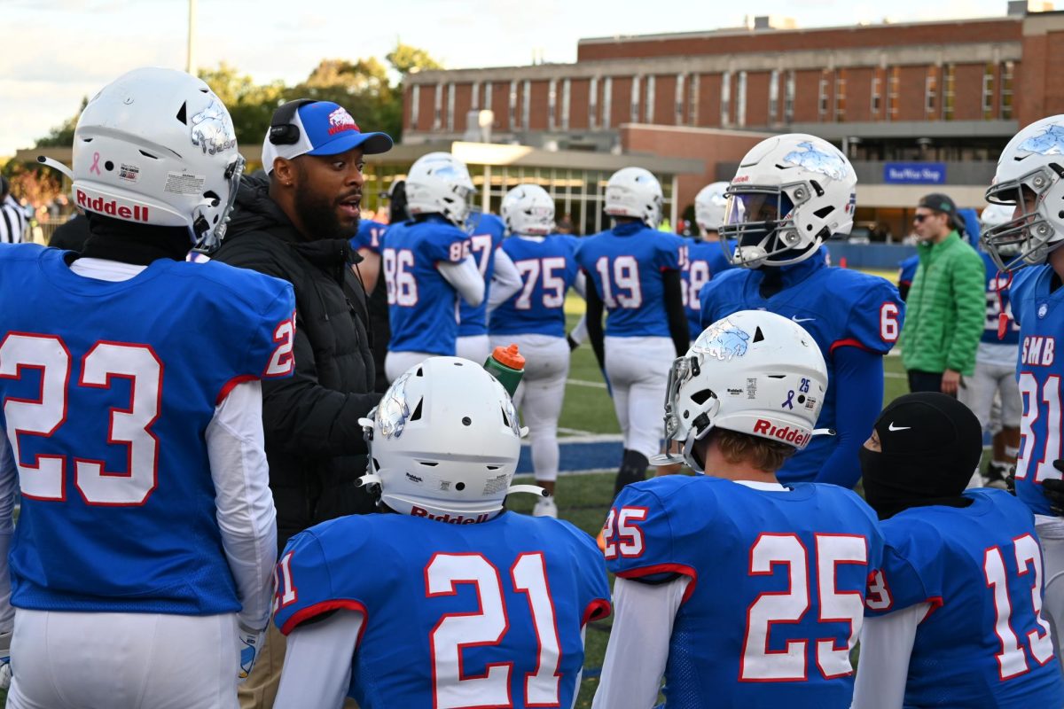 PREGAME PLANS. Coach Ced talked about the game plan with the players during a timeout at the start of the game. 