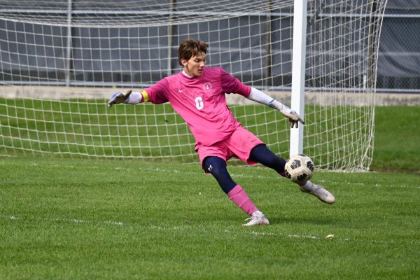 SOARING. Goalie Cooper Olson kicks the ball, soaring high above the field to teammates.