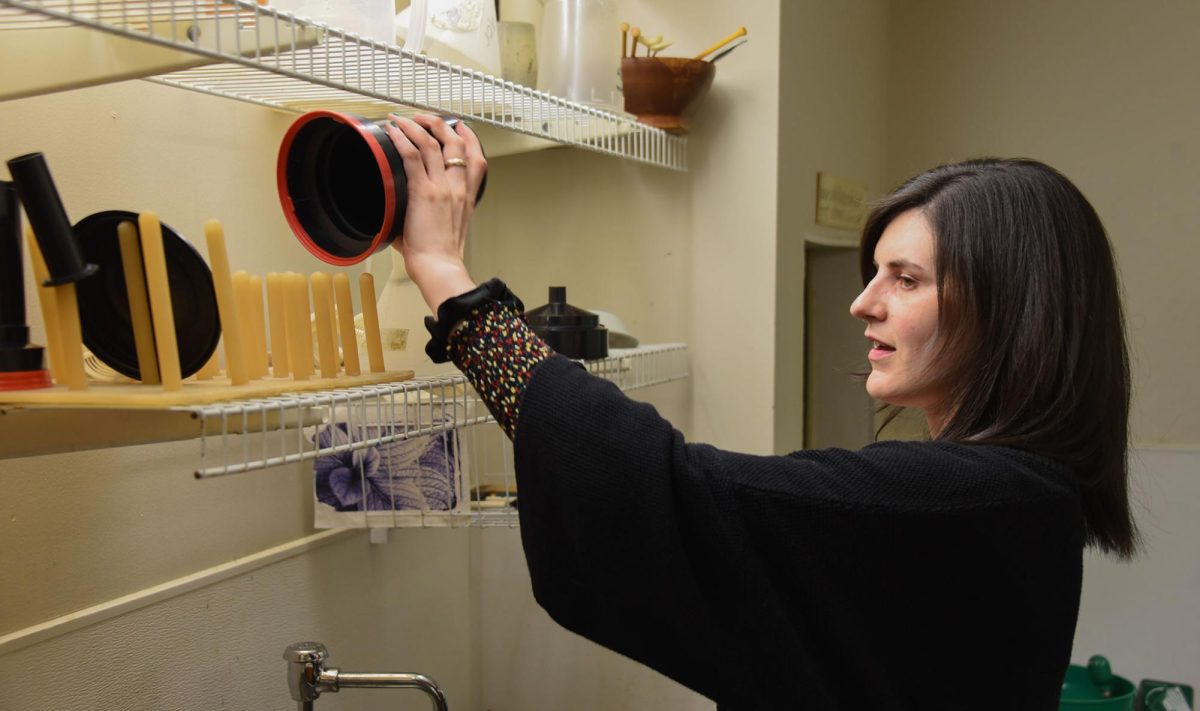 LIGHT LESSON. Photography and video arts teacher Kate Clark preps the darkroom for an upcoming class. I have students in the darkroom working with film, she said. Its been interesting, because Ive never had to manage a darkroom before. Im feeling pretty comfortable about mixing chemistry myself. Clark noted how supportive the environment has been whole also giving her autonomy with her classes.