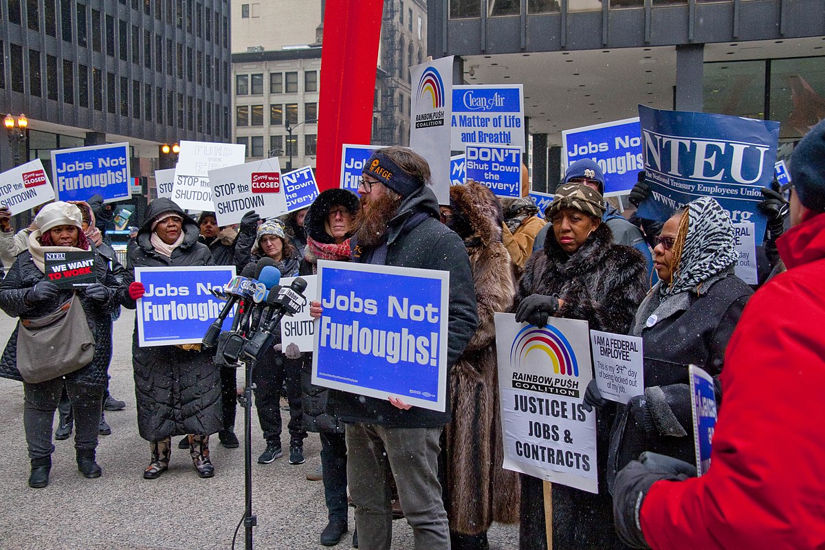 JOBS NOT FURLOUGHS. If the government shutdown had occurred, millions of federal workers across the country would have been furloughed or forced to work without pay indefinitely. “All non-essential services of the federal government would not open and those federal workers would not get their salaries; in many cases they’d be furloughed or temporarily laid off,” said upper school history teacher Aaron Shulow.