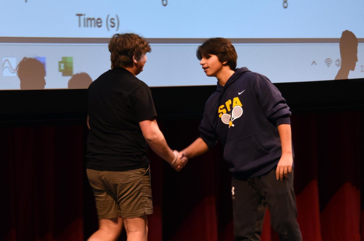 GOOD MATCH. Isaak Senaratna and Griffin Roy shaking hands before the big competition.