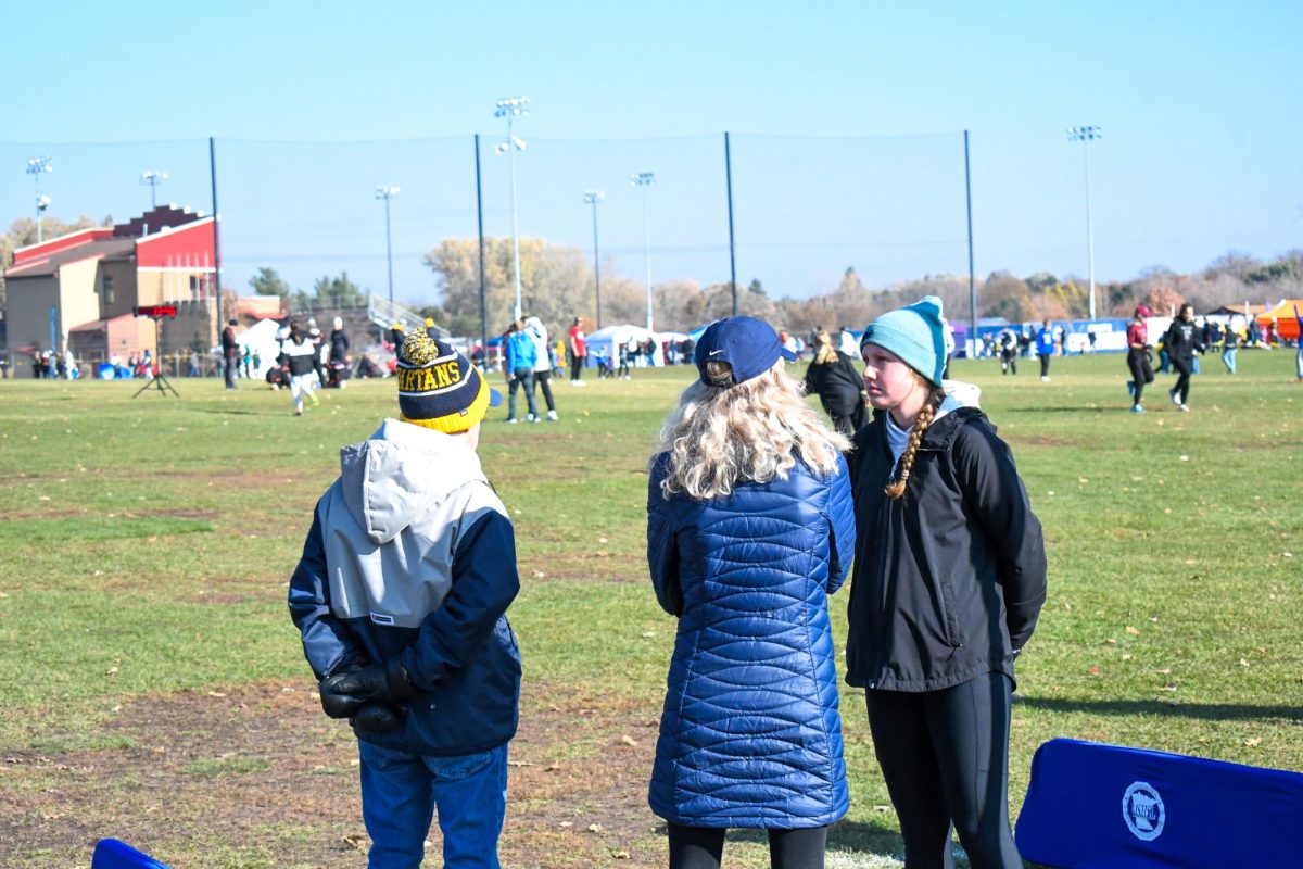 DEEP IN CONVERSATION. Head coach Robert Donnelly, and Sophie Schmitz, along with her assistant discussing race strategy prior to the race.