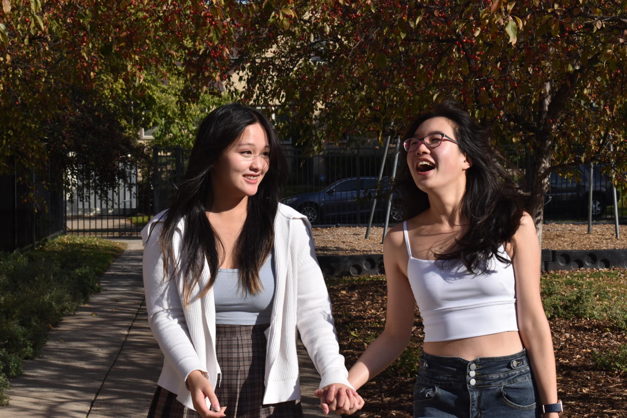 BFFS. Friends juniors Serene Kalugdan and Deling Cheng stroll in the lily courtyard.