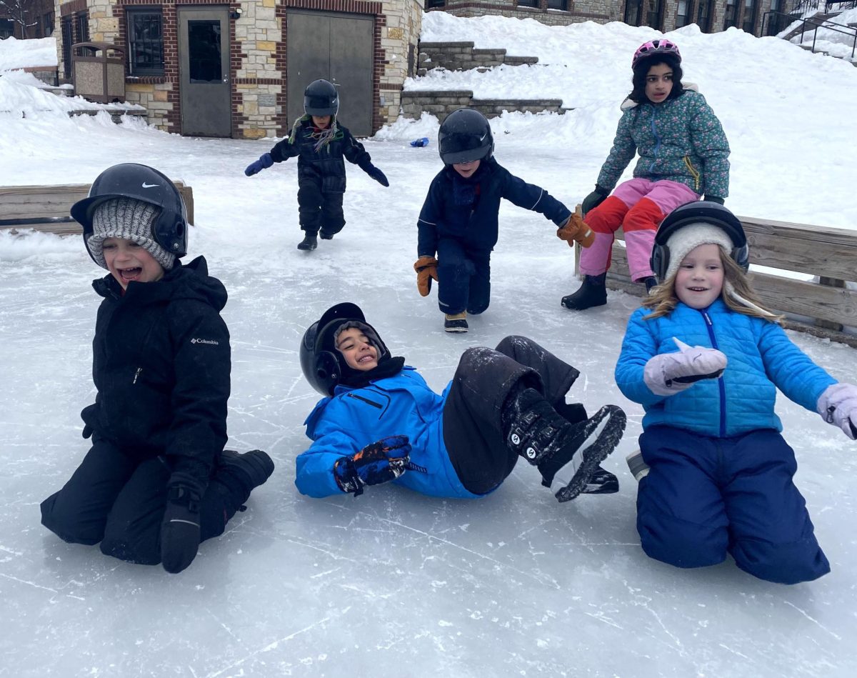 SLIDING ON ICE. Whether indoors or out, kids and AK coordinators have often had fun playing and skating outside. “I usually play some kind of game with the kids,” senior Tysen Hayes said.