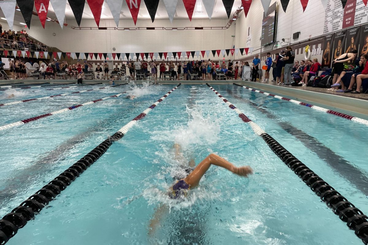 STRONG+FINISH.+Freshman+Audrey+Peltier+sprints+to+the+end+of+the+lane+in+the+200+freestyle+relay.+Peltier+has+been+dealing+with+shoulder+pain+this+season.+%E2%80%9CGoing+into+sections+we%E2%80%99re+not+super+confident+with+our+ability%2C%E2%80%9D+she+said.+