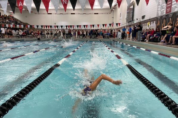STRONG FINISH. Freshman Audrey Peltier sprints to the end of the lane in the 200 freestyle relay. Peltier has been dealing with shoulder pain this season. “Going into sections we’re not super confident with our ability,” she said. 