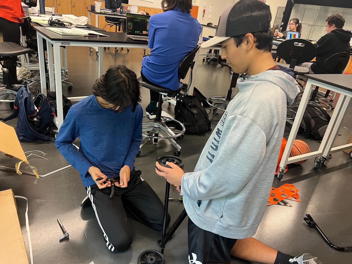 HARD AT WORK. Juniors Rohan Kharbanda and Humza Jameel work together to build a concrete mixer during an Advanced Science Research class. (Submitted Photo: Rohan Kharbanda)