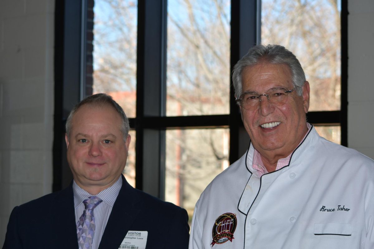 WHOLE FOODS. CEO Bruce Taher (right) founded his food service management company in 1981, fueled by a passion for ethically sourced food. “We prepare 75% of the food that we serve from our own ingredients … without preservatives, no additives, none of that stuff,” he said. Chris Leow, (left) is the district manager of the company and attended Paella day alongside Taher.