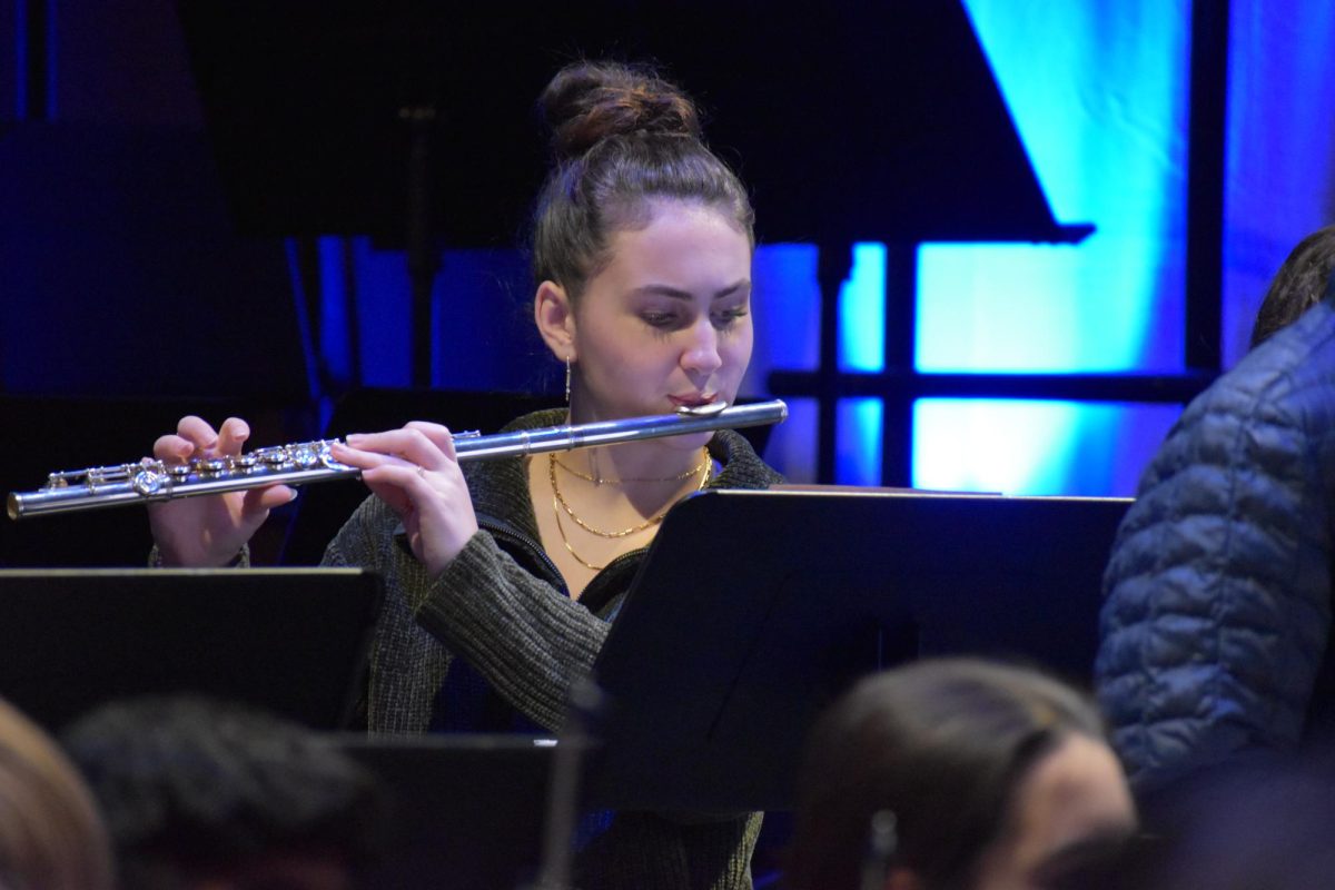 SILVER WHISTLE. Playing the flute is Senior Annika Lillegard for Honors Sinfonia.