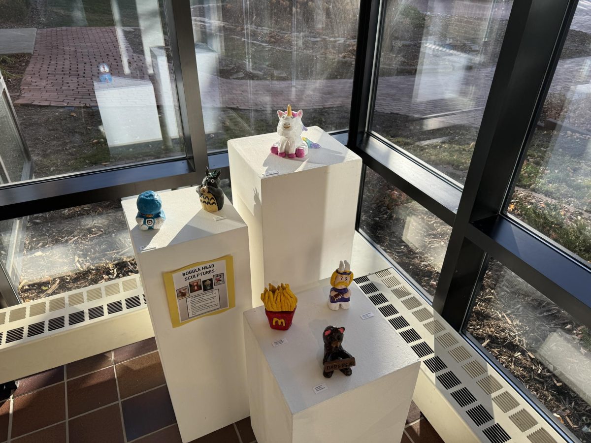 3D ART WORK. Small, clay, lifelike sculptures in the gallery. These pieces were made by students in the advanced sculpture class.