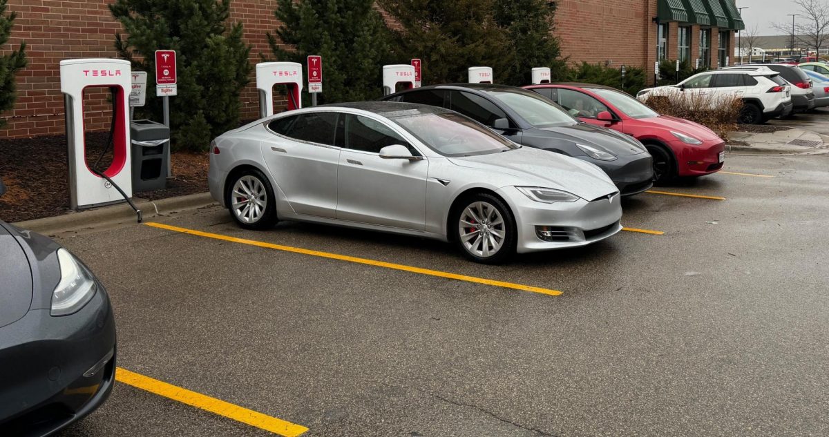 CHARGE WHILE SHOPPING. People shopping at the Hy-Vee supermarket in Oakdale are able to charge their Teslas while in the store.