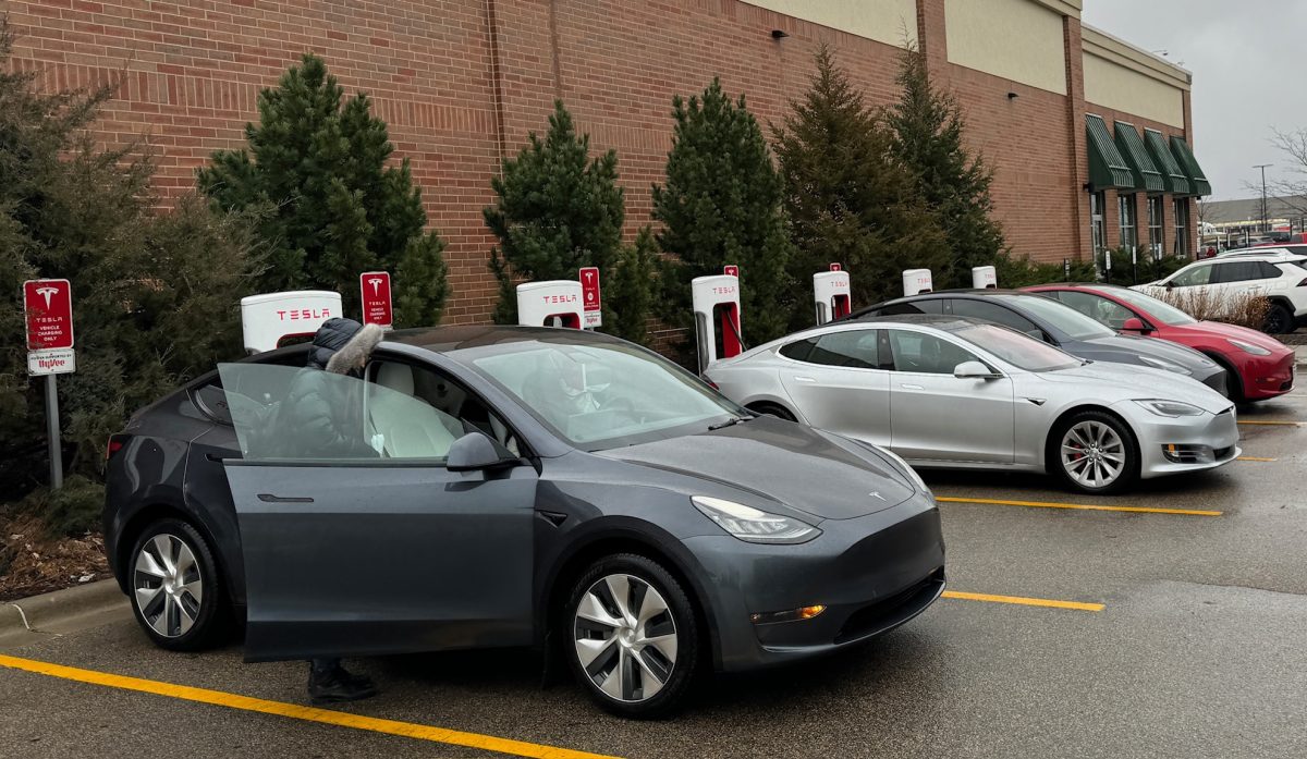 CHARGING THE CARS. People charge their Teslas at the Oakdale charging station.
