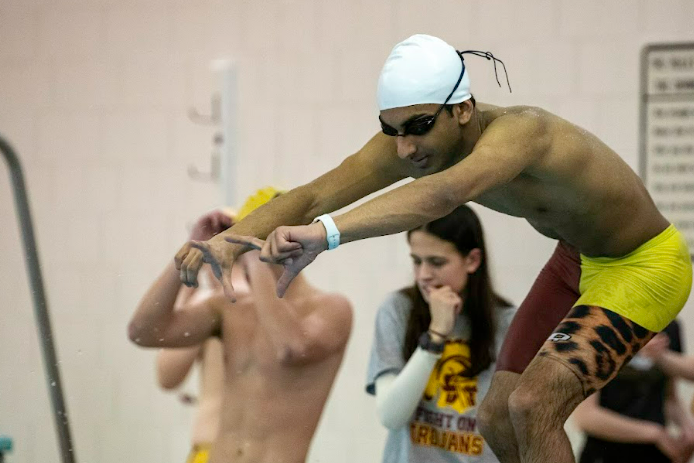TROJAN.+Senior+Rishi+Bhargava+prepares+to+dive+in+a+race+from+last+season.+For+the+first+time+this+year%2C+Bhargava+became+a+captain+of+the+Trojan+swim+team.+I+really+want+to+share+my+passion+for+swimming+with+the+rest+of+the+team+and+help+out+by+being+a+leader+and+doing+my+part%2C+he+said.