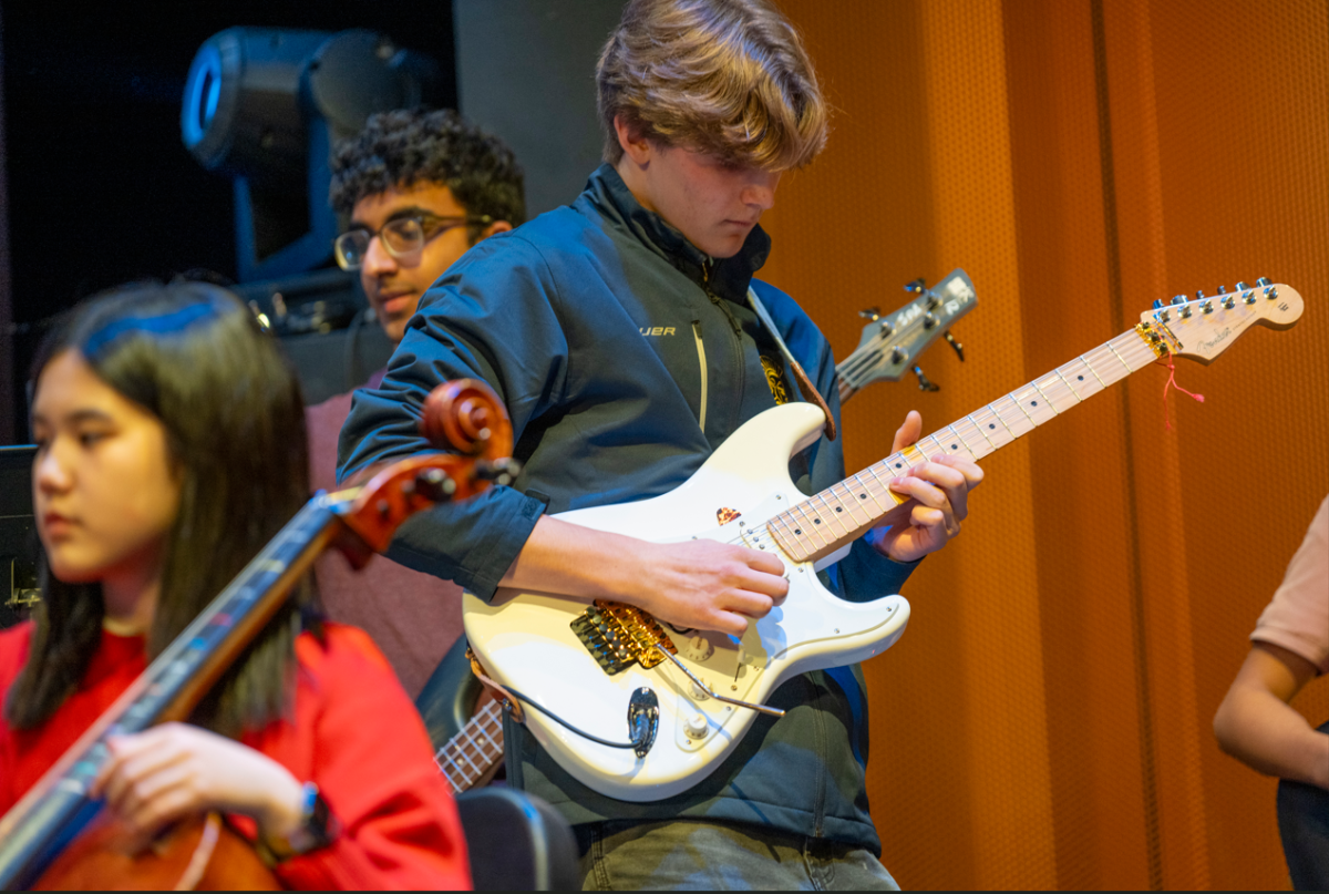ROCK ON. The spotlight shines on electric guitarist senior Isak Bildtsen as he leads Honors Sinfonia through the set of hit songs by the iconic band Queen. The songs performed were “We Will Rock You,” “Another One Bites The Dust”, and “We Are The Champions.”