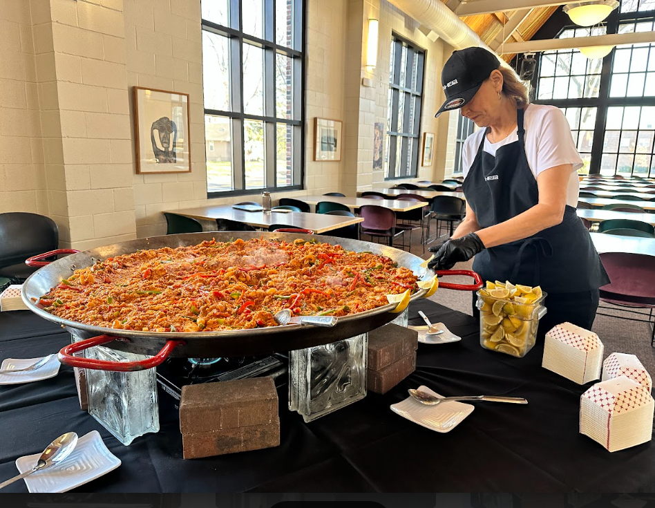 Bruce Taher explained he chose to prepare paella because it is a comfort food of his. Where does paella originate? Check out the graphic.