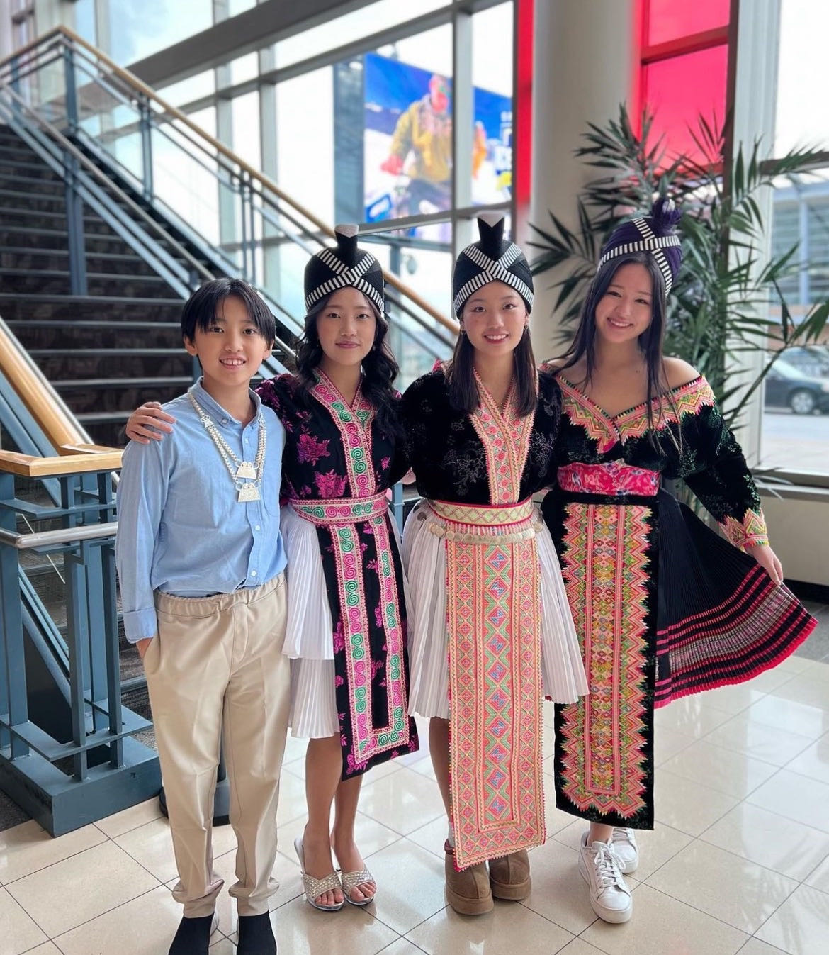 FAMILY FESTIVITES. Junior Serene Kalugdan poses with her family at Hmong New Year. Apart from celebrating with her family, Hmong New Year is a chance for the community to connect as a whole. When my mom went to Hmong New Year it was a huge thing because that was the only way they could meet people from around the world, Kalugdan said. (Submitted Photo: Serene Kalugdan)