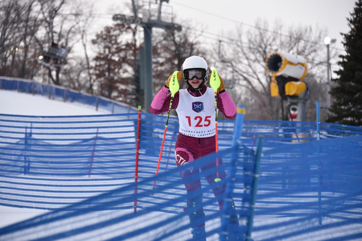ALL SMILES. Freshman Juliette Smith smiles coming off of her first run. This was her first IMAC race in high school and she placed 30th overall. “[The season] is feeling pretty good so far,” Smith said. 