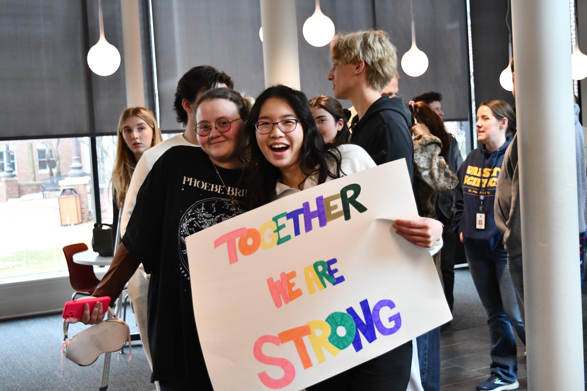 BETTER TOGETHER. Ronnie Dixon and Deling Chen smile as they march in support of sexual consent. After an assembly about sexual assault and consent, all students and faculty participated in a short march around the upper school.