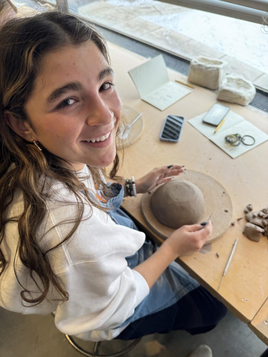 HAPPY WITH THE WORK. Sophomore Lucia Gonzalez working on her teapot.