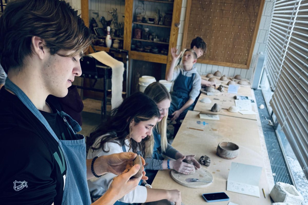 WORKING FOR FUN. Junior Ethan Peltier making a creative project in Ceramics One. "I am not making anything in particular, I just like working on stuff I'm passionate about."