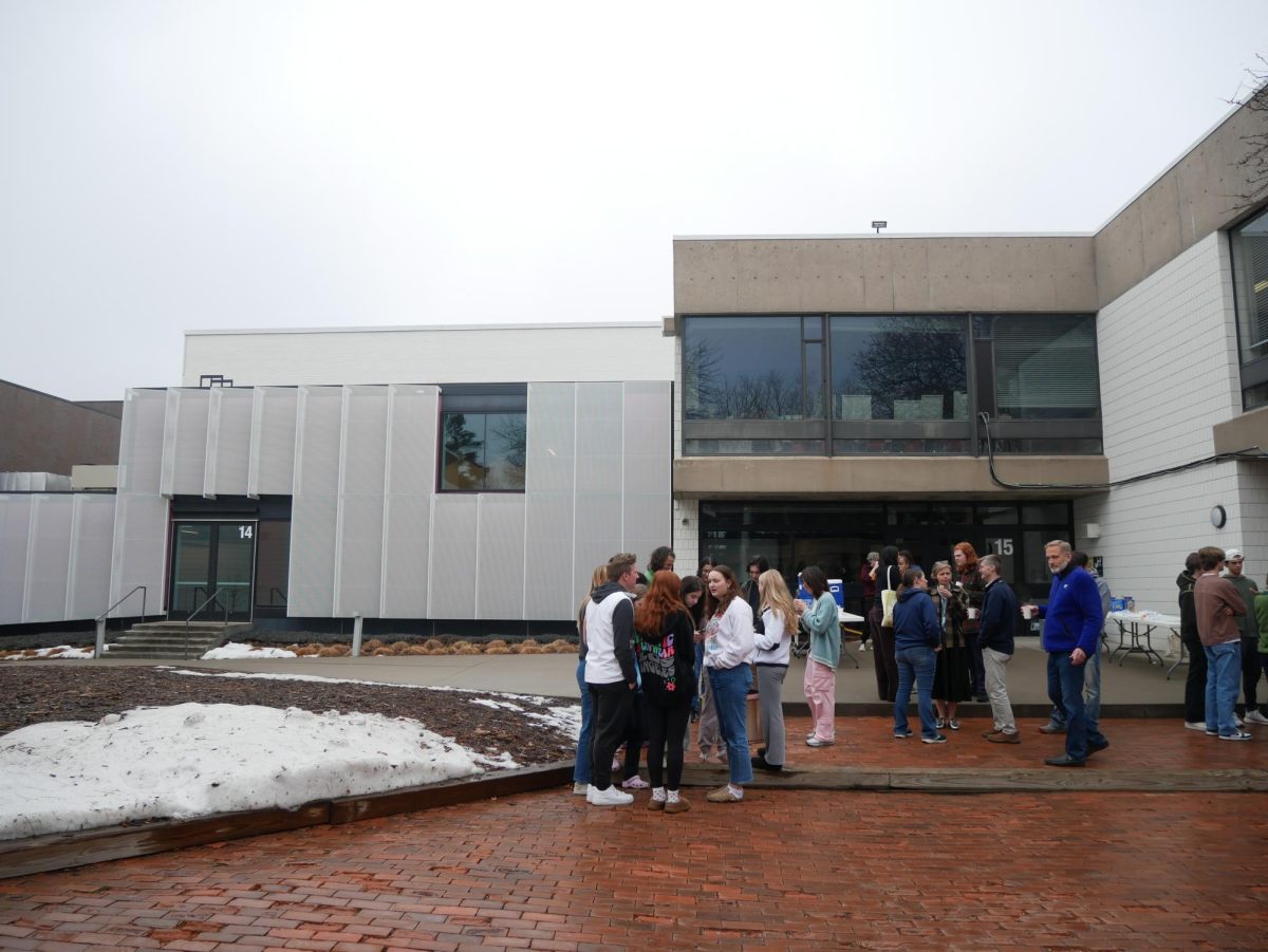 GATHER 'ROUND. Community members cluster around fire pits in the unusual January warmth. Students and teachers alike enjoyed some time off during the busy Community Day schedule. 