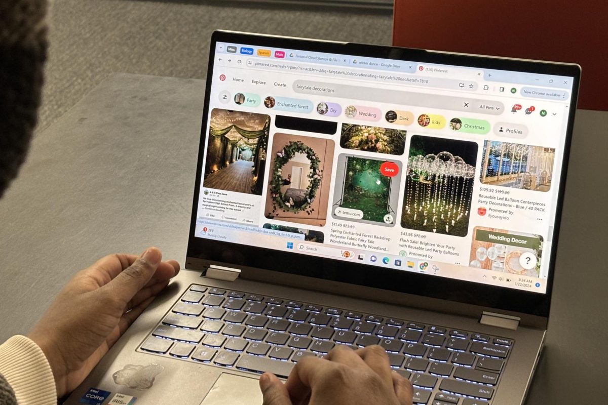 LIKE A FAIRYTALE. SAC sophomore representative Nijah Johnson logs into Pinterest on her laptop to brainstorm decoration ideas fit for the theme of the Winter Dance: fairytale.