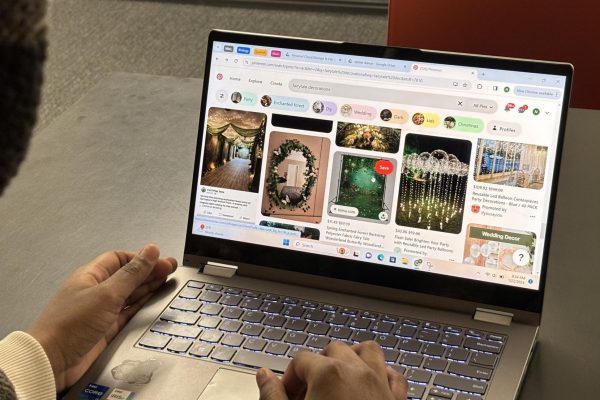 LIKE A FAIRYTALE. SAC sophomore representative Nijah Johnson logs into Pinterest on her laptop to brainstorm decoration ideas fit for the theme of the Winter Dance: fairytale. 