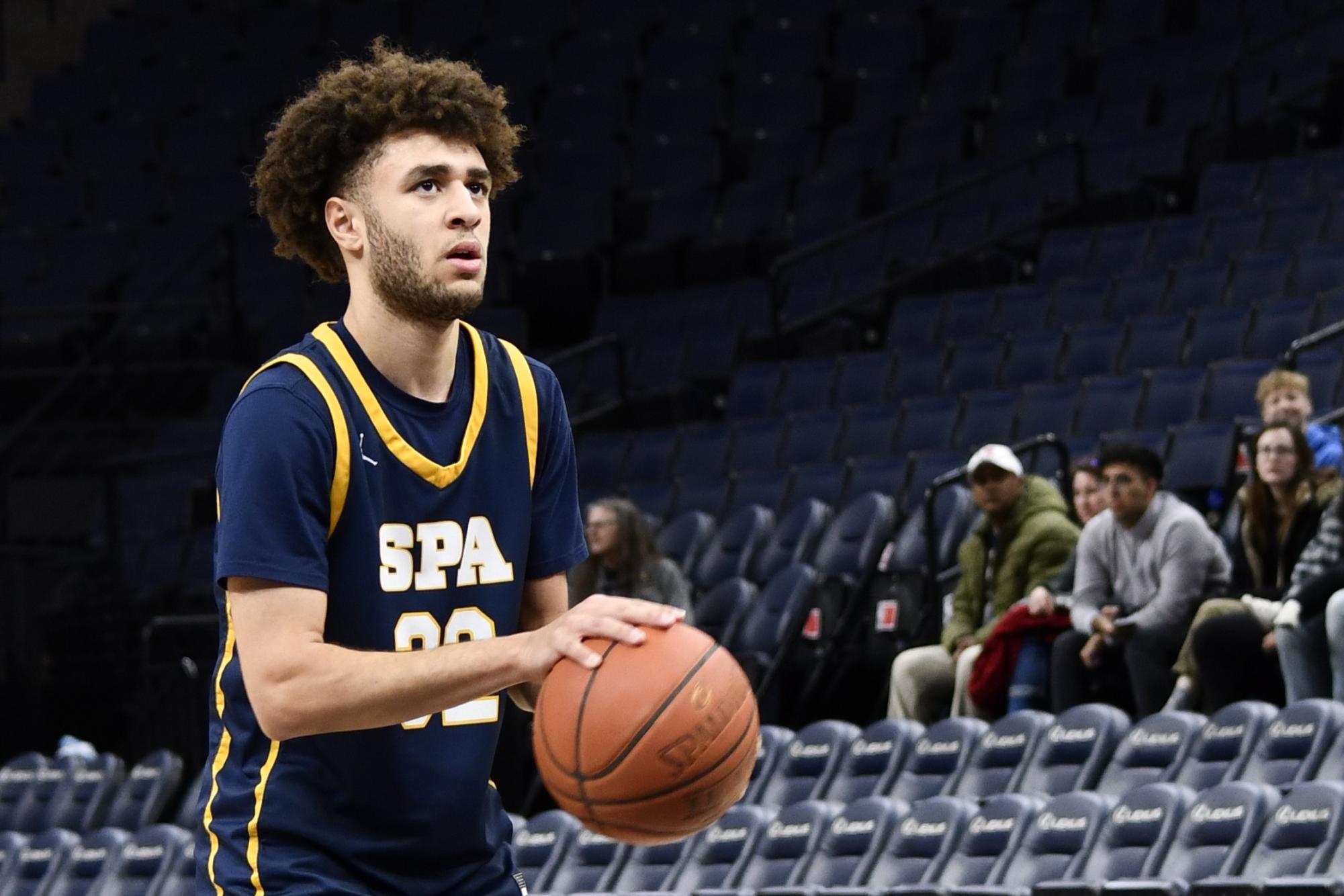 SHOOTING MY SHOT. Captain Ethan Carter shoots a free throw during the game at the Target Center. He had recently earned 1000 total career points. 