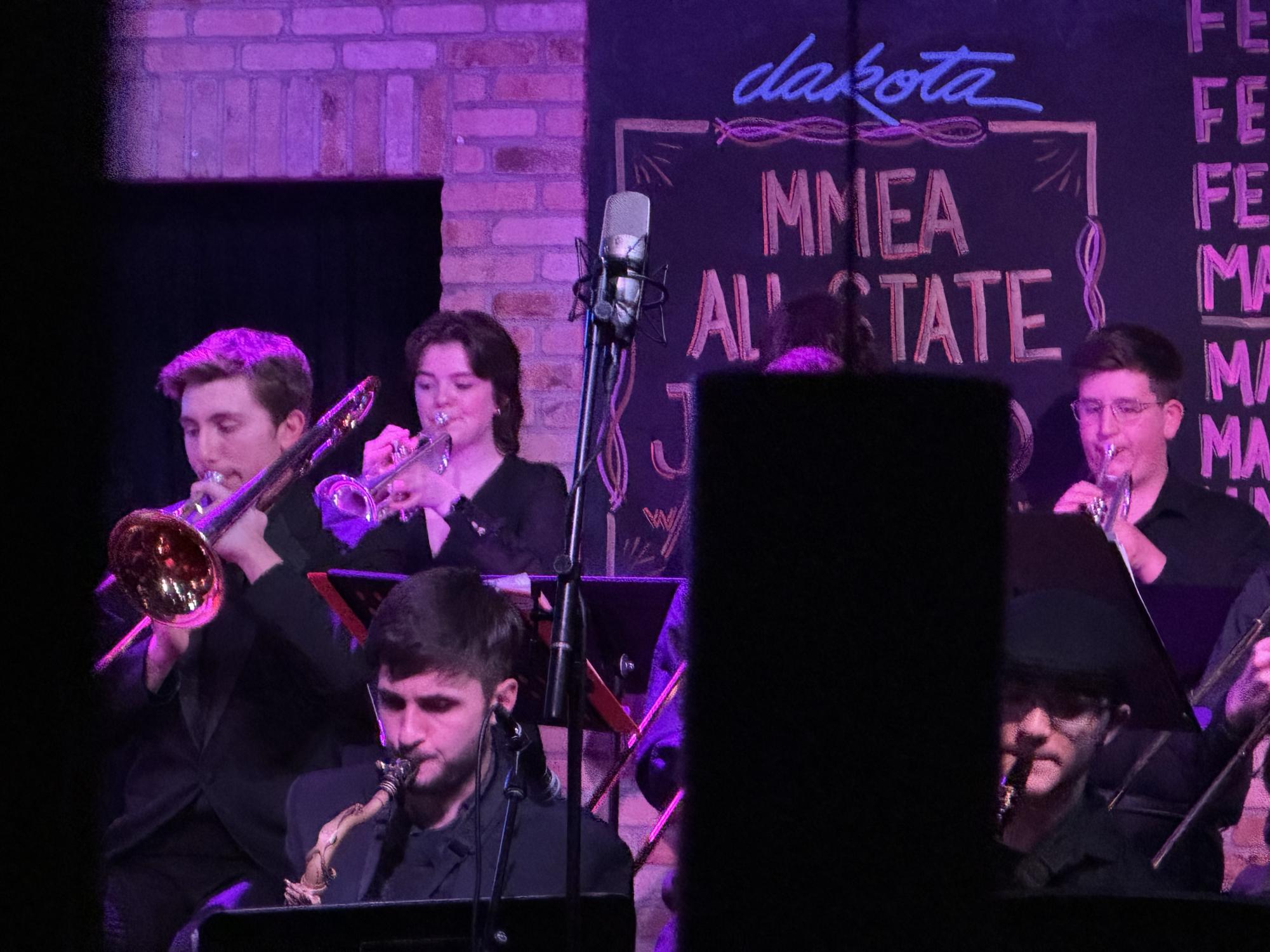 LOST IN THE MUSIC. Senior Bridget Keel plays in the Mid-Winter Convention. 