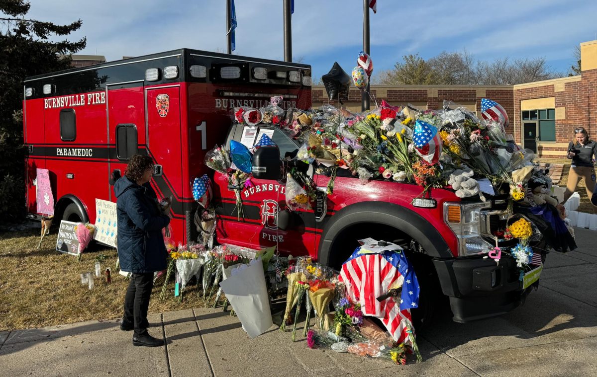 UNITED RESPONSE. The ambulance of fallen paramedic Adam Finseth, who was shot and killed when attempting to help officers who were shot after responding to a domestic situation. The ambulance was covered in flowers and notes for the family.