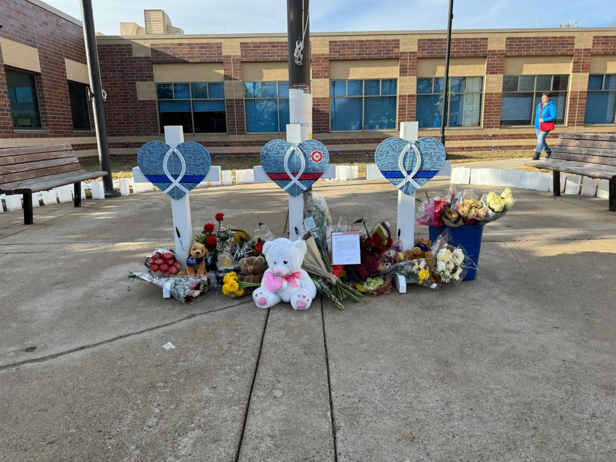 REMEMBERING. A smaller memorial for the three first responders shot and killed is surrounded by lanterns.