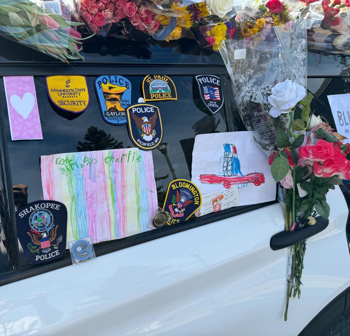 SOLIDARITY. On the car, badges from police departments from various cities throughout the state show the widespread support.