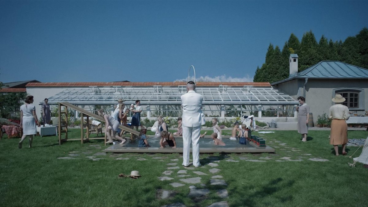 REALISTIC VILLAINY. The Zone of Interest follows the Höss families day-to-day lives living in a house directly bordering the Auschwitz concentration camp. (Screenshot from The Zone of Interest official trailer) 
