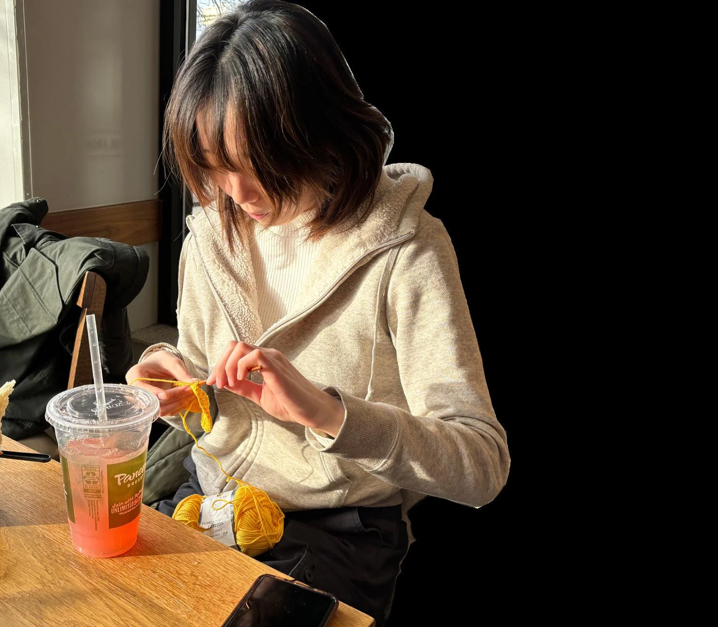 ONE STITCH AT A TIME. Junior Belle Weng works on crocheting a mesh bag for her cucumbers. Some of Weng’s other creations include a cardigan, flowers, and beanies. Her most recent project was a pair of yellow flowers, intended to be given to a friend as celebration for her play’s debut. Weng chooses her next projects based on both her own, as well as friends’ and family’s interests: “[I] usually make things that make good gifts [such as] hats, scarves, or bags for my mom. Or I see a cool clothing pattern I want to try,” she said.