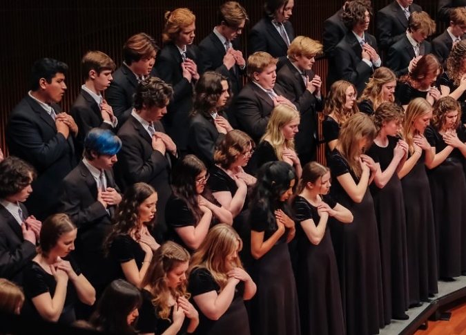 SING YOUR HEART OUT. Seifert and Kannankutty are part of two seperate choirs under the organization. Both seniors have found joy singing alongside individuals who share the same passion for choral music as them. "It's just really beautiful to see so many people dedicated to something that they love," Kannankutty said. (Image via @angelicachoirs on Instagram)