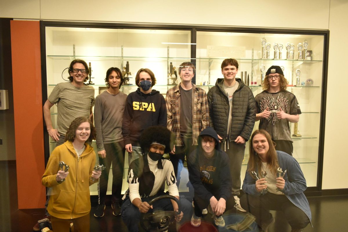 GO-KART ENGINEERS. The Engineering Club stands outside the design lab after working on their go-kart project for the year. 