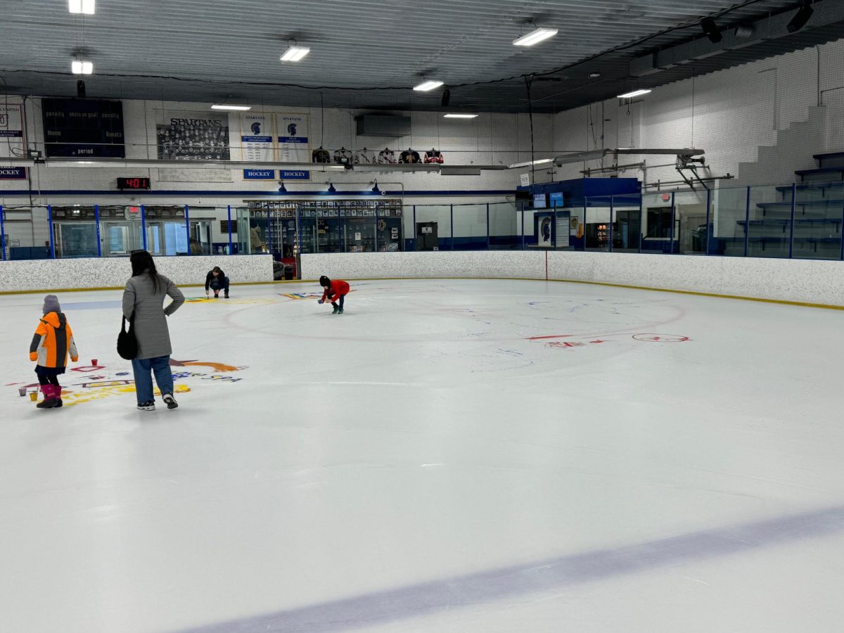 PAINT YOUR WORLD. A number of Lower School families attending the Paint the Ice Event on March 4th.