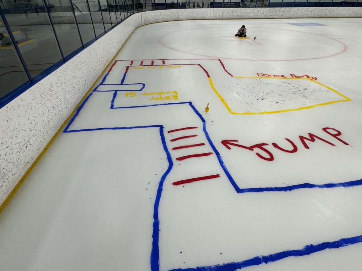 WHAT EVER YOU MAKE IT. A Lower School family paints an obstacle course on the ice.