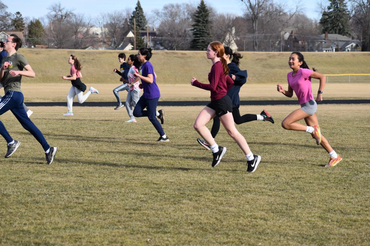 STRIDE. The track and field team practices their different stride styles. Many athletes run different distances, but starting early and practicing a diverse set of running styles sets the athletes up for success in any event. “If you start your good habits early you are less likely to be injured due to poor form,” captain Bridget Keel said. 