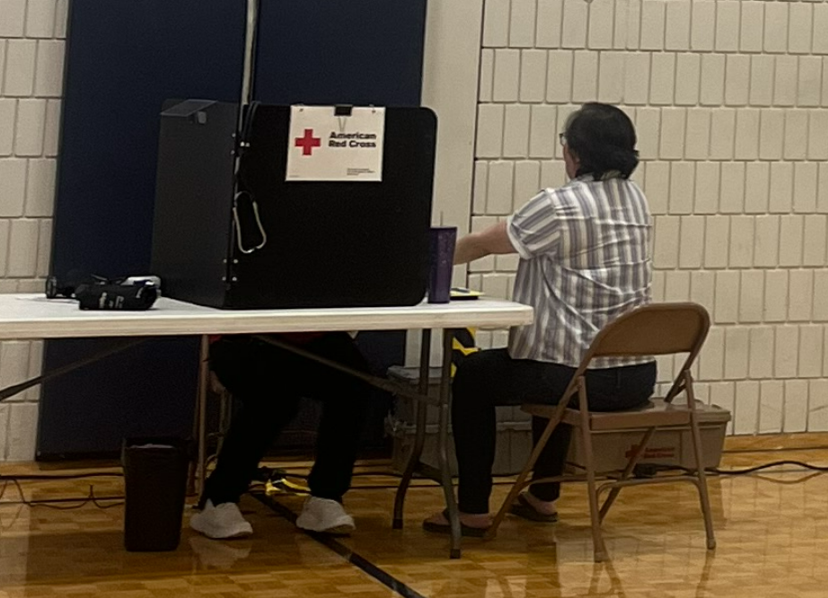 GIVING BLOOD. Upper School english teacher Akie Kutsunai waits her turn to donate blood.