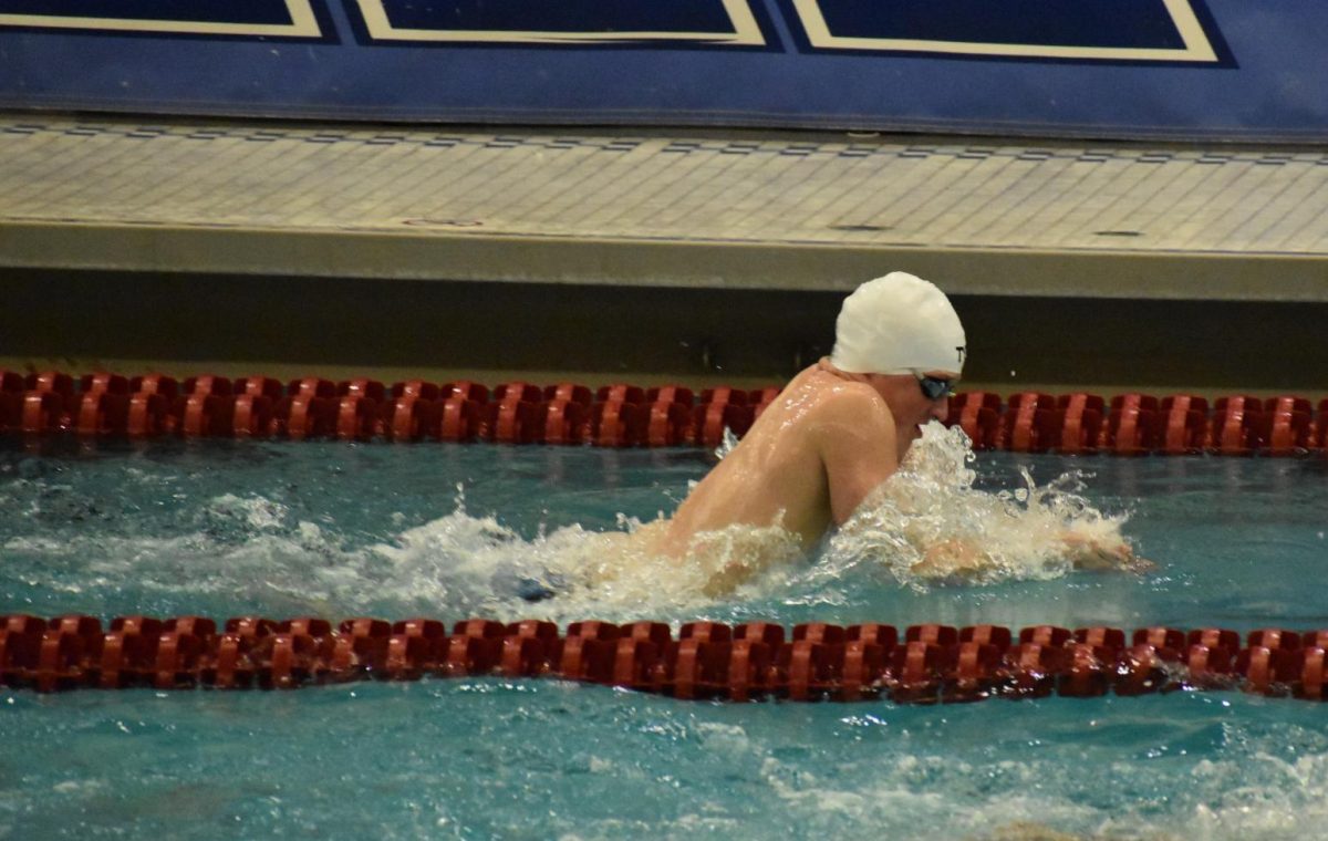 SPEED. Senior Fred Myers performs the breaststroke portion of the relay. Leading up to sections, Myers replaced senior Rishi Bhargava in breaststroke. This change allowed the team to shave off some of their time.