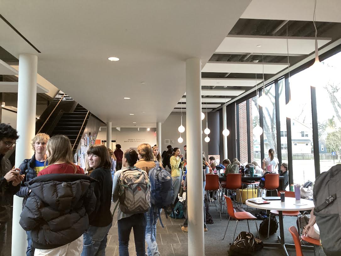 AN INDOOR AFFAIR. Students crowd inside to enjoy snacks and livestreams rather than the initially planned lawn viewing.