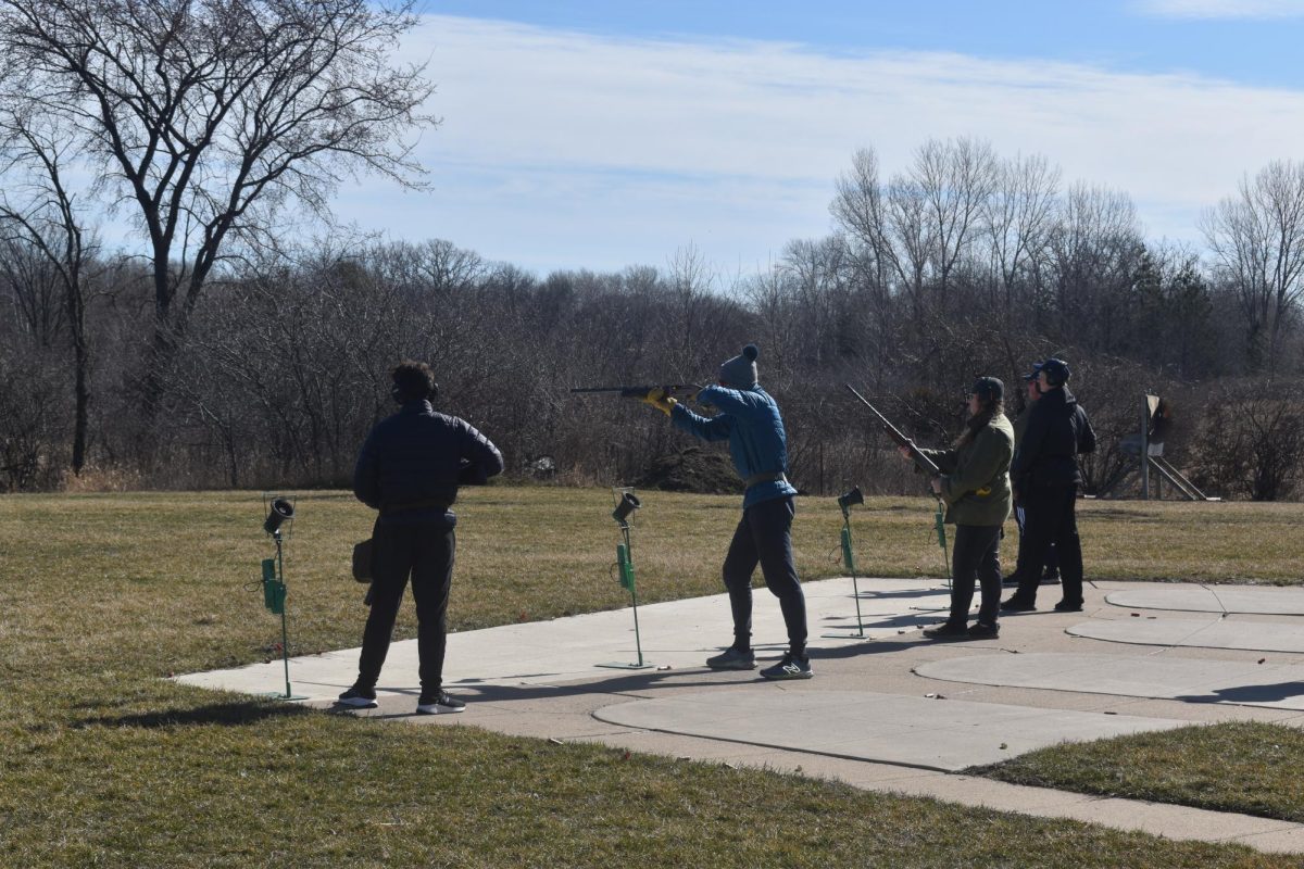 BIRD WATCHING. Freshman William O’Brien stares down the sight of his shotgun, waiting for the clay pigeon to fly out.