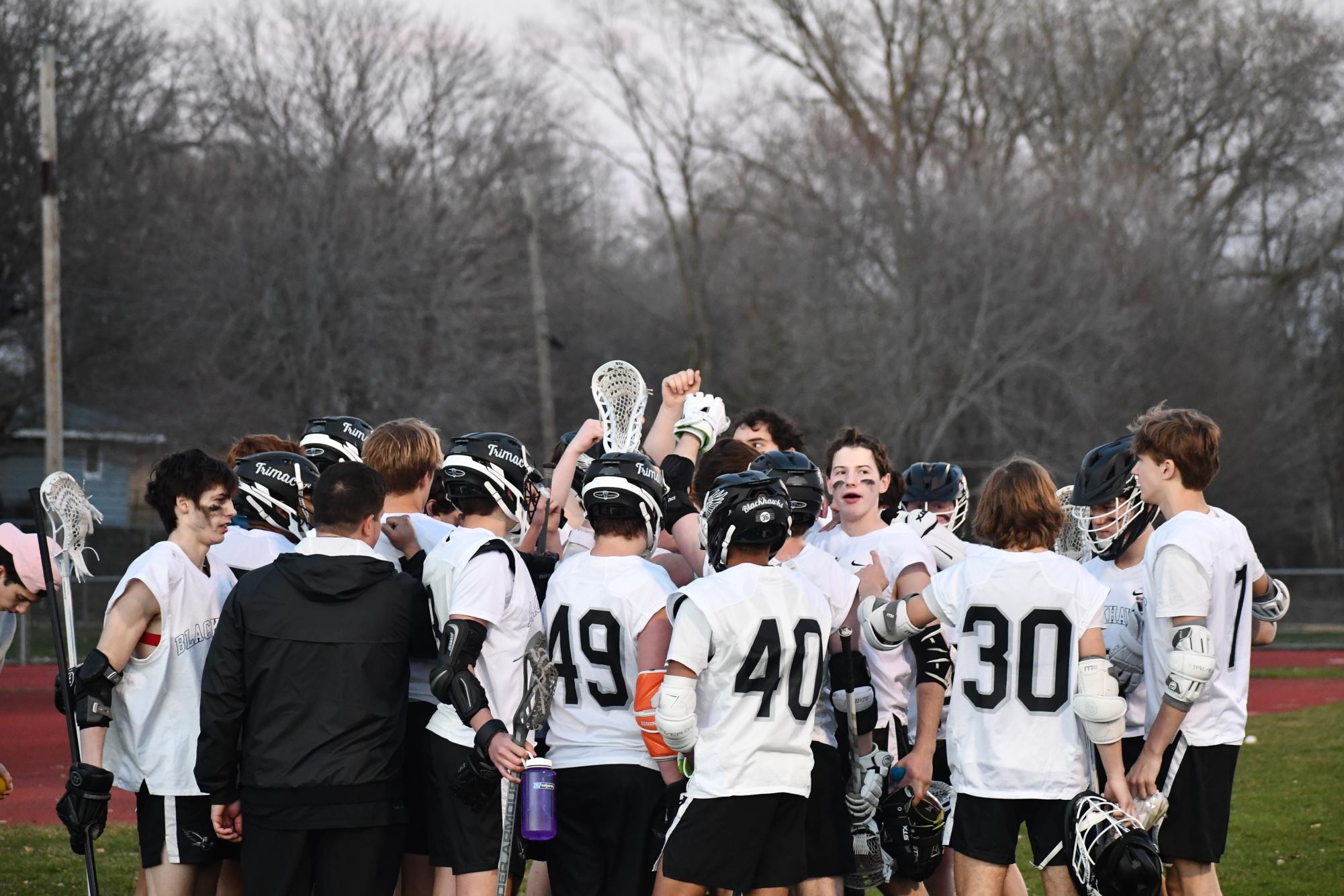 WE ARE FAMILY. The Blackhawks huddle together before the second half of the game