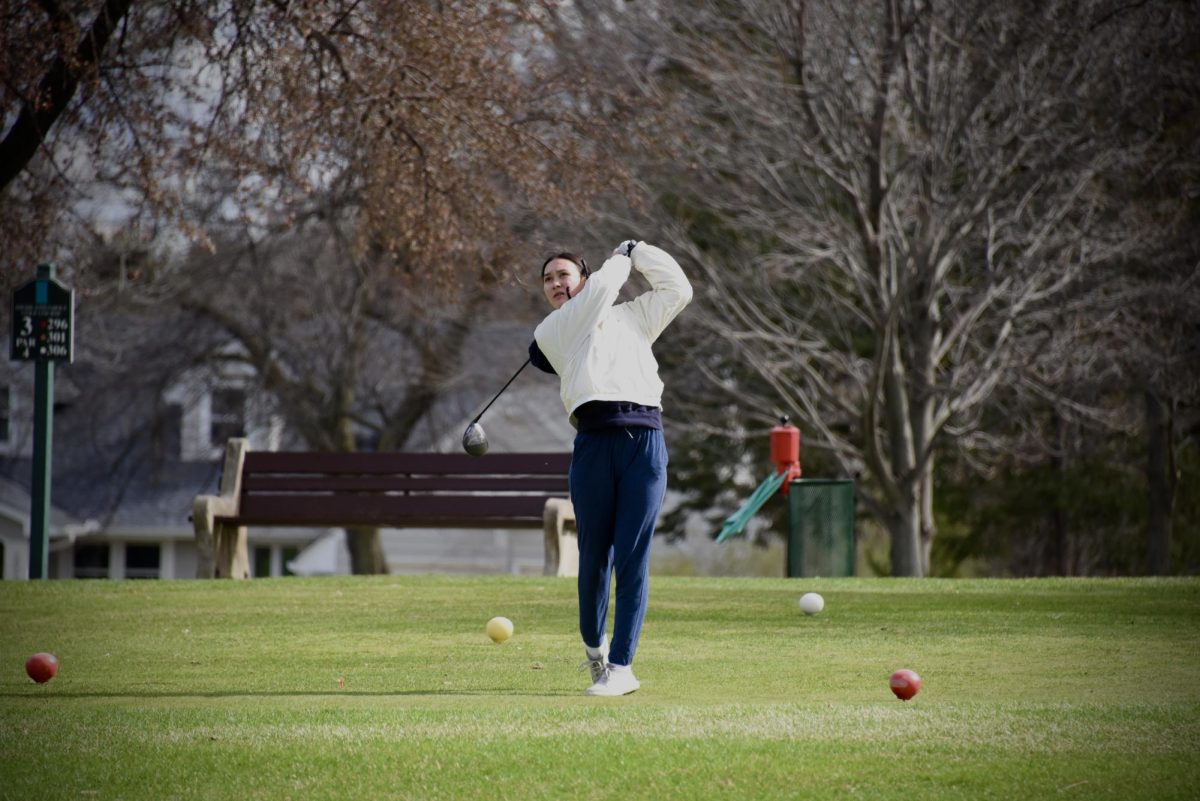 SWUNG. Peony Steele watches for her ball as she tees off on the the fourth tee.